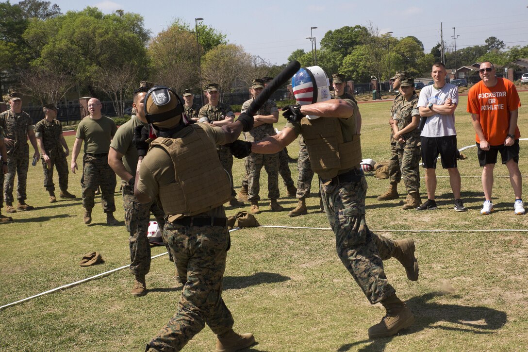 NEW ORLEANS - Marines with Headquarters Battalion, Marine Forces Reserve, deliver solid blows to each other during the MARFORRES King of the Ring Competition at Marine Corps Support Facility New Orleans, March 22, 2017. The competition featured three separate events to include grappling, knife fighting, and combative baton, all hosted by the MARFORRES Martial Arts Team. The winners of the three competitions will earn a large trophy and the title as champion until next year’s competition.  (U.S. Marine Corps photo by Cpl. Devan Alonzo Barnett/Released)