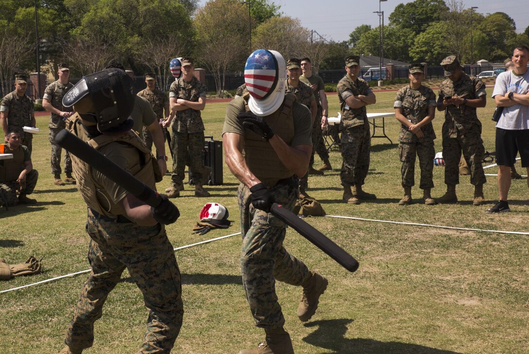 NEW ORLEANS - Marines with Headquarters Battalion, Marine Forces Reserve, deliver solid blows to each other during the MARFORRES King of the Ring Competition at Marine Corps Support Facility New Orleans, March 22, 2017. The competition featured three separate events to include grappling, knife fighting, and combative baton, all hosted by the MARFORRES Martial Arts Team. The winners of the three competitions will earn a large trophy and the title as champion until next year’s competition.  (U.S. Marine Corps photo by Cpl. Devan Alonzo Barnett/Released)