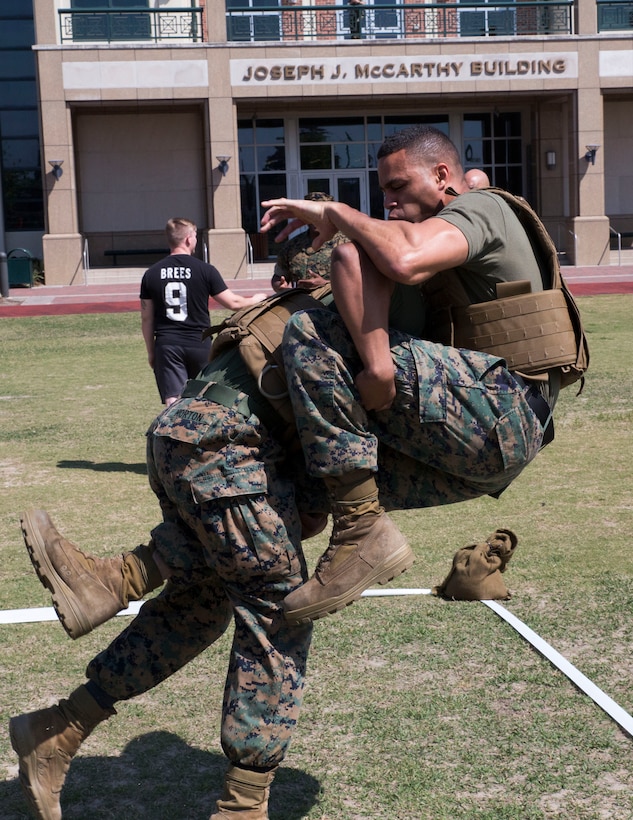 NEW ORLEANS - Cpl. Edward Morton, an administration clerk with Headquarters Battalion, Marine Forces Reserve, takes down Sgt. William Culp, the 4th Marine Aircraft Wing accounting chief, during the MARFORRES King of the Ring Competition at Marine Corps Support Facility New Orleans, March 22, 2017. The competition featured three separate events to include grappling, knife fighting, and combative baton, all hosted by the MARFORRES Martial Arts Team. The winners of the three competitions will earn a large trophy and the title as champion until next year’s competition.  (U.S. Marine Corps photo by Cpl. Devan Alonzo Barnett/Released)