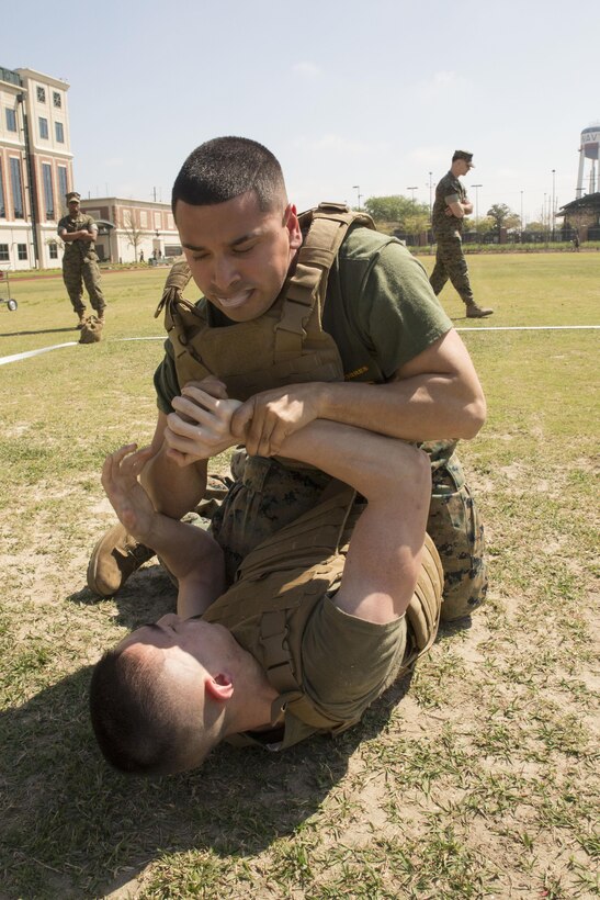 NEW ORLEANS - Cpl. Anthony Navarro (top) an administration clerk with Headquarters Battalion, Marine Forces Reserve, attempts a submission against Pfc. Niles Lee, a mass communications Marine with MARFORRES, during the MARFORRES King of the Ring Competition at Marine Corps Support Facility New Orleans, March 22, 2017. The competition featured three separate events to include grappling, knife fighting, and combative baton, all hosted by the MARFORRES Martial Arts Team. The winners of the three competitions will earn a large trophy and the title as champion until next year’s competition.  (U.S. Marine Corps photo by Cpl. Devan Alonzo Barnett/Released)