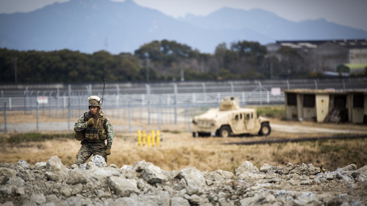 U.S. Marine Corps Gunnery Sgt. Ysac Perez, the air base ground defense staff non-commissioned officer in charge for Marine Wing Support Squadron 171, observes how Marines deal with the set objectives during exercise Tanuki Wrath at Marine Corps Air Station Iwakuni, Japan, March 22, 2017. MWSS-171 conducted the exercise to help train Marines to set up security around a downed aircraft and how to control a riot.