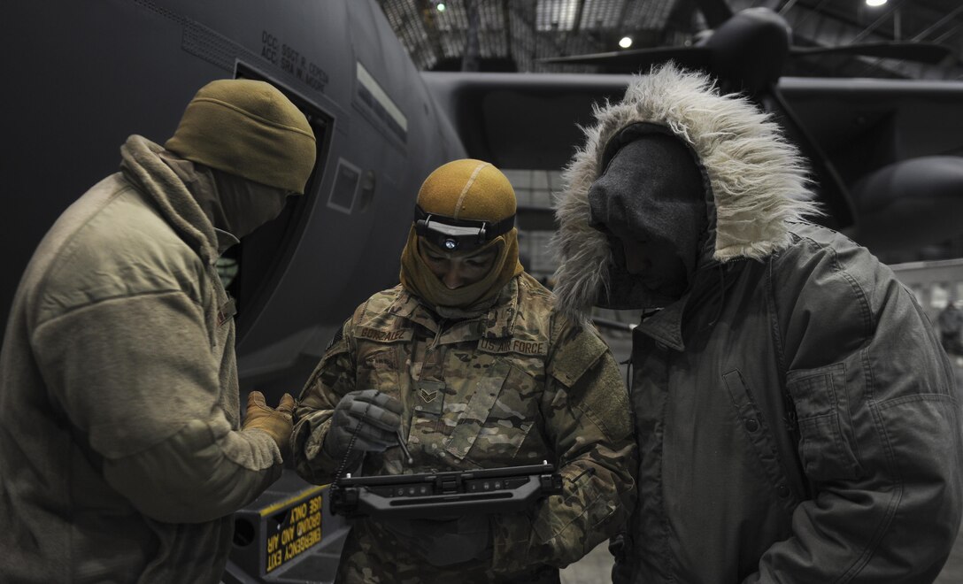 Air Commandos from the 1st Special Operations Aircraft Maintenance Squadron look at a step-by-step checklist at Eglin Air Force Base, Fla., March 21, 2017. This checklist was used to bring power to the AC-130J Ghostrider gunship while it underwent its first cold soak, a test done to examine the aircrafts operational competence and resilience in arctic temperatures. (U.S. Air Force photo by Airman 1st Class Dennis Spain)