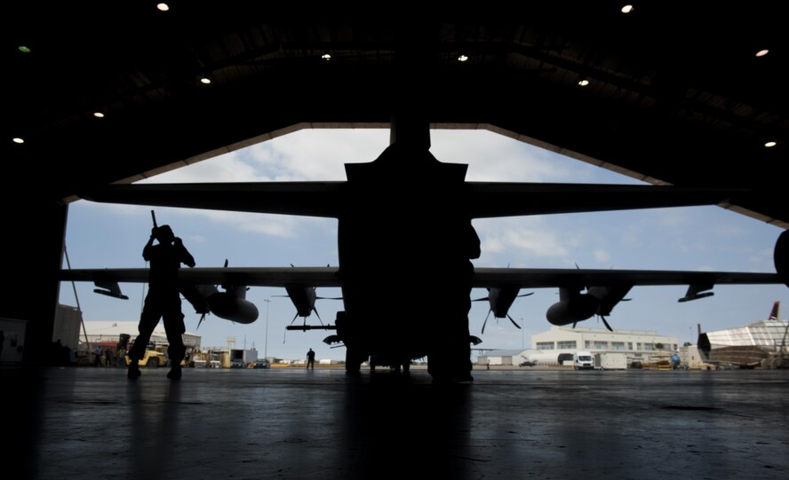 Staff Sgt. Nikolas Kimmel, a crew chief with the 1st Special Operations Aircraft Maintenance Squadron, tail walks an AC-130J Ghostrider gunship at Eglin Air Force Base, Fla., March 20, 2017. Kimmel wing walked the gunship to safely usher the aircraft into the McKinley Climatic Laboratory, a hangar used to test an aircraft’s ability to operate under extreme conditions, such as low temperatures and high winds. (U.S. Air Force photo by Airman 1st Class Dennis Spain)