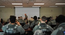 U.S. Air Force 8th Security Forces Squadron Airmen receive a mission briefing before a field training exercise at Kunsan Air Base, Republic of Korea, March 17, 2017. During briefings, security forces members receive information on hazards, safety and mission objectives. (U.S. Air Force photo by Senior Airman Colville McFee/Released)