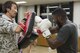 Staff Sgt. Dustin Payne, 374th Airlift Wing public affairs broadcast craftsman, prepares for his kickboxing amateur debut at a gym in the Hachioji ward of Tokyo, Japan, Mar. 14, 2017. Payne has been training with professional Japanese kickboxers for a year and a half. (U.S. Air Force photo by Senior Airman David C. Danford)