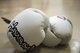 A pair of kickboxing gloves belonging to Staff Sgt. Dustin Payne, 374th Airlift Wing public affairs broadcast craftsman, lie in a gym in the Hachioji ward of Tokyo, Japan, Mar. 14, 2017. Payne has been training with professional Japanese kickboxers for a year and a half. (U.S. Air Force photo by Senior Airman David C. Danford)