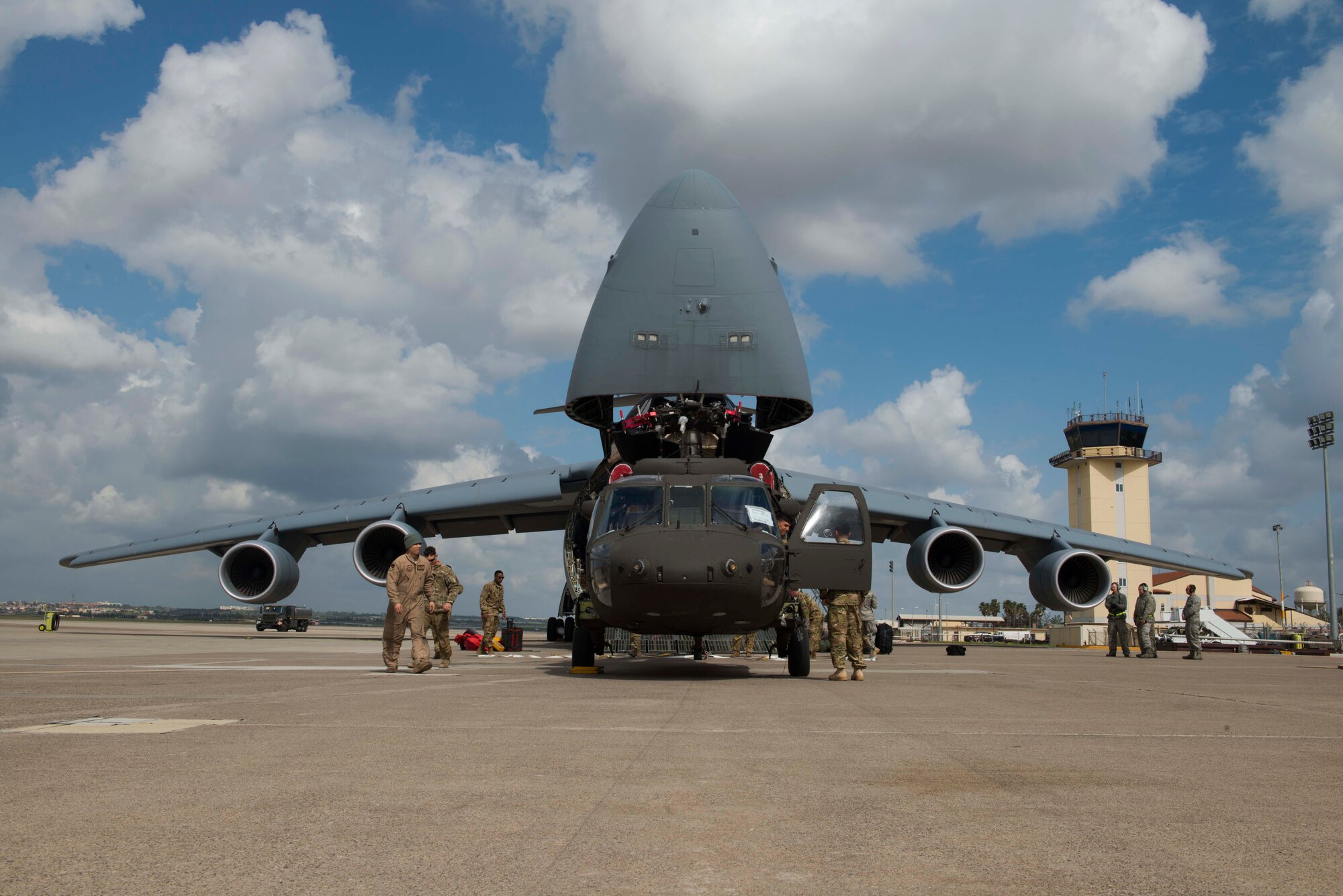 U.S. Airmen with the 22nd Airlift Squadron and U.S. Soldiers with the 3rd Battalion, 501st Regiment, Combat Aviation Brigade, 1st Armored Division prepare to load a U.S. Army UH-60 Black Hawk onto a U.S. Air Force C-5M Super Galaxy March 14, 2017, at Incirlik Air Base, Turkey. The unit was deployed to Incirlik in support of Operation Atlantic Resolve. (U.S. Air Force photo by Airman 1st Class Devin M. Rumbaugh)