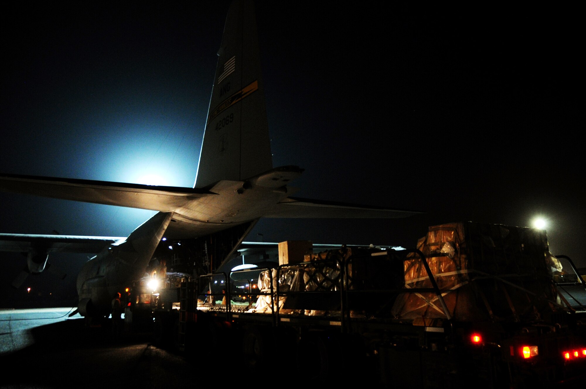 A C-130H Hercules is unloaded on the flightline by Airmen of the 386th Air Expeditionary Wing Mar. 3, 2017 at an undisclosed location in Southwest Asia. This aircraft is used to deliver personnel and cargo downrange in support of Operation Inherent Resolve.  (U.S. Air Force photo/Tech. Sgt. Kenneth McCann)