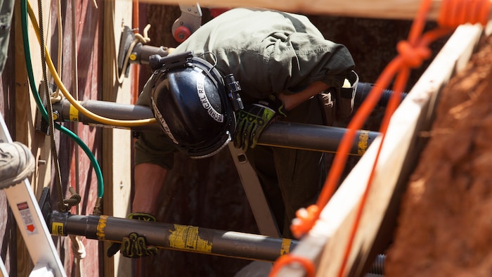 Cpl. Alexander Sutter, a Marine with Chemical Biological Incident Response Force fixes plywood into a 12-foot trench at Guardian Centers in Perry, Ga., March 20, 2017, during Exercise Scarlet Response 2017. The exercise, which goes from March 20 – 25, is the largest annual event for CBIRF, and it tests the unit’s capabilities to react and respond to threats and disasters such as nuclear detonations.