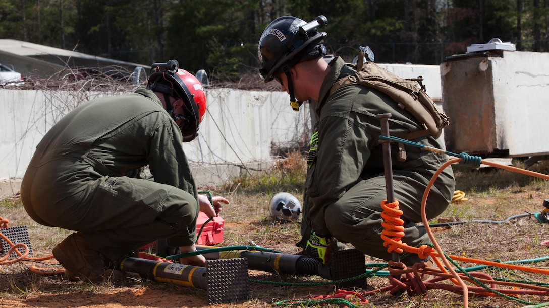 Lance Cpl. Lukas Musselwhite, left, and Lance Cpl. Robert Honeycutt, both Marines with Chemical Biological Incident Response Force, prepare struts to fix plywood into a 12-foot trench at Guardian Centers in Perry, Ga., March 20, 2017, during Exercise Scarlet Response 2017. The exercise, which goes from March 20 – 25, is the largest annual event for CBIRF, and it tests the unit’s capabilities to react and respond to threats and disasters such as nuclear detonations.