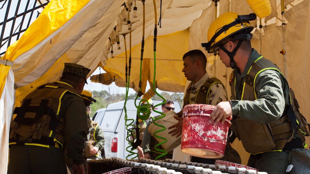 Marines with Chemical Biological Incident Response Force prepare a decontamination tent during a drill at Guardian Centers in Perry, Ga., March 20, 2017, during Exercise Scarlet Response 2017. The exercise, which goes from March 20 – 25, is the largest annual event for CBIRF, and it tests the unit’s capabilities to react and respond to threats and disasters such as nuclear detonations.