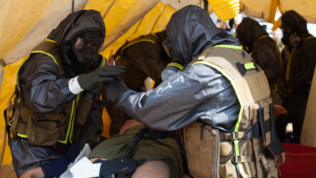 Marines with Chemical Biological Incident Response Force strip and decontaminate casualties during a drill at Guardian Centers in Perry, Ga., March 20, 2017, during Exercise Scarlet Response 2017. The exercise, which goes from March 20 – 25, is the largest annual event for CBIRF, and it tests the unit’s capabilities to react and respond to threats and disasters such as nuclear detonations.