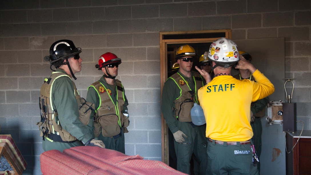 Marines with Chemical Biological Incident Response Force search a collapsed building at Guardian Centers in Perry, Ga., March 21, 2017, during Exercise Scarlet Response 2017. The Marines searched through the building to annotate damage and extract any victims in the building. The exercise, which goes from March 20 – 25, is the largest annual event for CBIRF, and it tests the unit’s capabilities to react and respond to threats and disasters such as nuclear detonations.