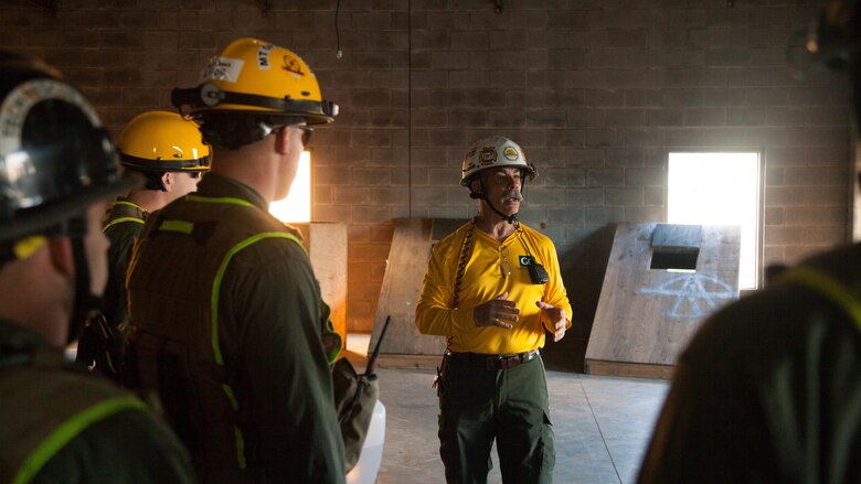 Mack Tabor, an instructor with Spec Rescue International, speaks to Marines with Chemical Biological Incident Response Force at Guardian Centers in Perry, Ga., March 21, 2017, during Exercise Scarlet Response 2017. The Marines search through the building to annotate damage and extract any victims in the building. The exercise, which goes from March 20 – 25, is the largest annual event for CBIRF, and it tests the unit’s capabilities to react and respond to threats and disasters such as nuclear detonations.