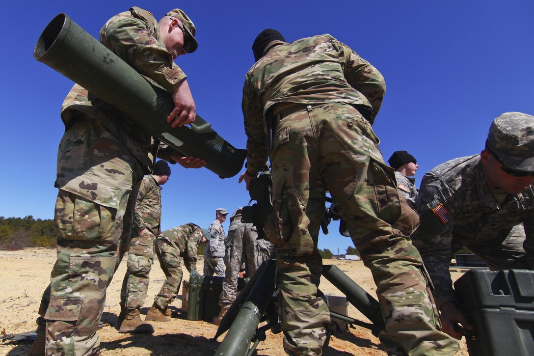 Army National Guardsmen unpack BGM-71 anti-tank guided missile launchers during training at Joint Base McGuire-Dix-Lakehurst, N.J., March 23, 2017. The missile launcher is commonly known as a TOW. Air National Guard photo by Master Sgt. Matt Hecht