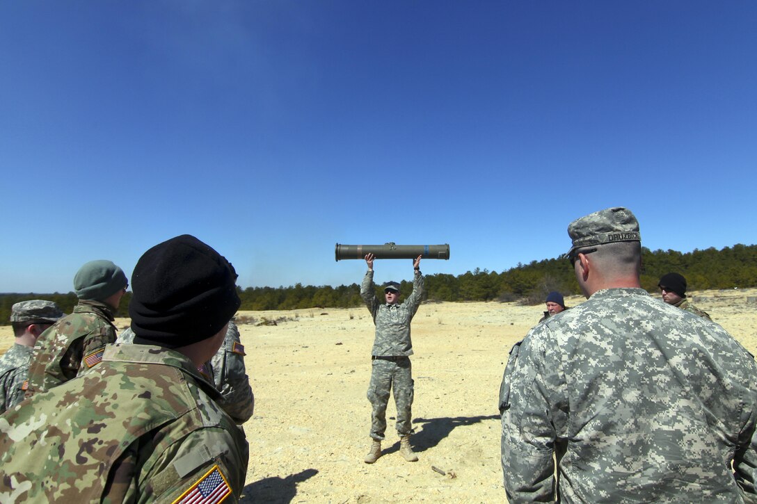 An Army National Guardsman demonstrates the correct way to load a BGM-71 anti-tank missile during training at Joint Base McGuire-Dix-Lakehurst, N.J., March 23, 2017. The soldier is assigned to the 50th Infantry Brigade Combat Team. Air National Guard photo by Master Sgt. Matt Hecht