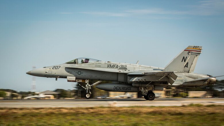 An F/A-18C Hornet aircraft takes off during a field carrier landing practice aboard Marine Corps Air Station Beaufort, March 22, 2017. This FCLP was conducted in preparation for an upcoming exercise aboard the USS Theodore Roosevelt, a naval aircraft carrier, scheduled for April. The pilot and the aircraft are with VMFA-312, Marine Aircraft Group 31.