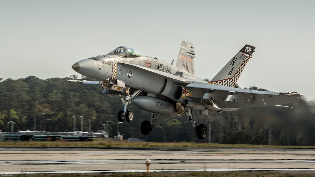 An F/A-18C Hornet aircraft takes off during a field carrier landing practice aboard Marine Corps Air Station Beaufort, March 22, 2017. Marine Fighter Attack Squadron 312 conducts the training before embarkation aboard carriers. This FCLP was conducted in preparation for an upcoming exercise aboard the USS Theodore Roosevelt, a naval aircraft carrier, scheduled for April. The pilot and the aircraft are with VMFA-312, Marine Aircraft Group 31.