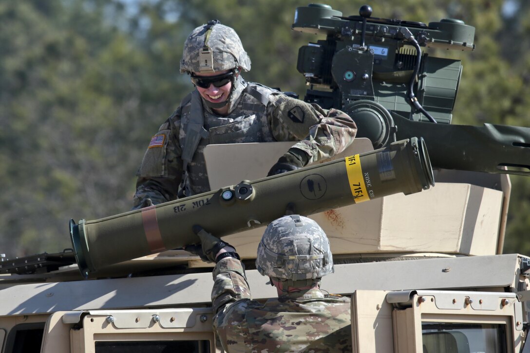 An Army National Guardsman smiles after firing a BGM-71 anti-tank missile during training at Joint Base McGuire-Dix-Lakehurst, N.J., March 23, 2017. Air National Guard photo by Master Sgt. Matt Hecht