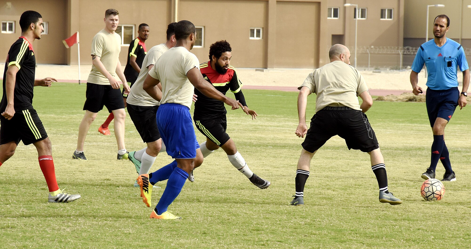 U.S. Air Force Airmen with the 379th Expeditionary Security Forces Squadron play soccer with Qatar Emiri Air Force Security Forces members at Al Udeid Air Base, Qatar, March 23, 2017. The Airmen participated in a friendly game of soccer held to give members a chance to interact with their host nation partners. (U.S. Air Force photo by Senior Airman Cynthia A. Innocenti)