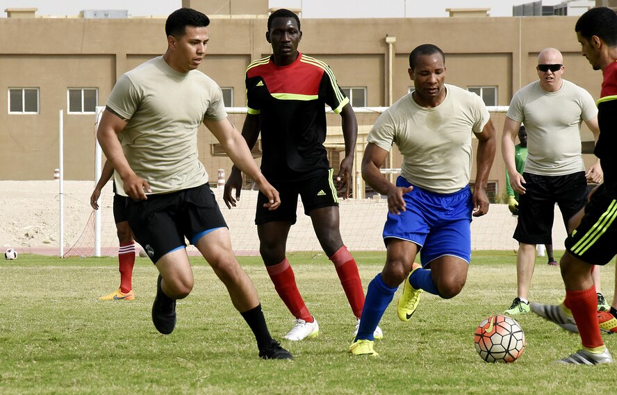 U.S. Air Force Airmen with the 379th Expeditionary Security Forces Squadron play soccer with Qatar Emiri Air Force Security Forces members at Al Udeid Air Base, Qatar, March 23, 2017. The Airmen participated in a friendly game of soccer held to give members a chance to interact with their host nation partners. (U.S. Air Force photo by Senior Airman Cynthia A. Innocenti)