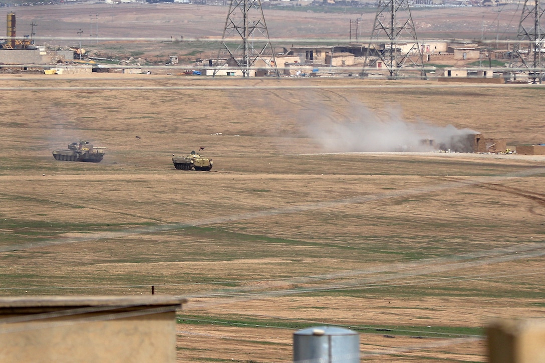 Iraqi army heavy armor vehicles engage an ISIS position on the western edge of Mosul, Iraq, March 19, 2017. Army photo by Staff Sgt. Jason Hull 