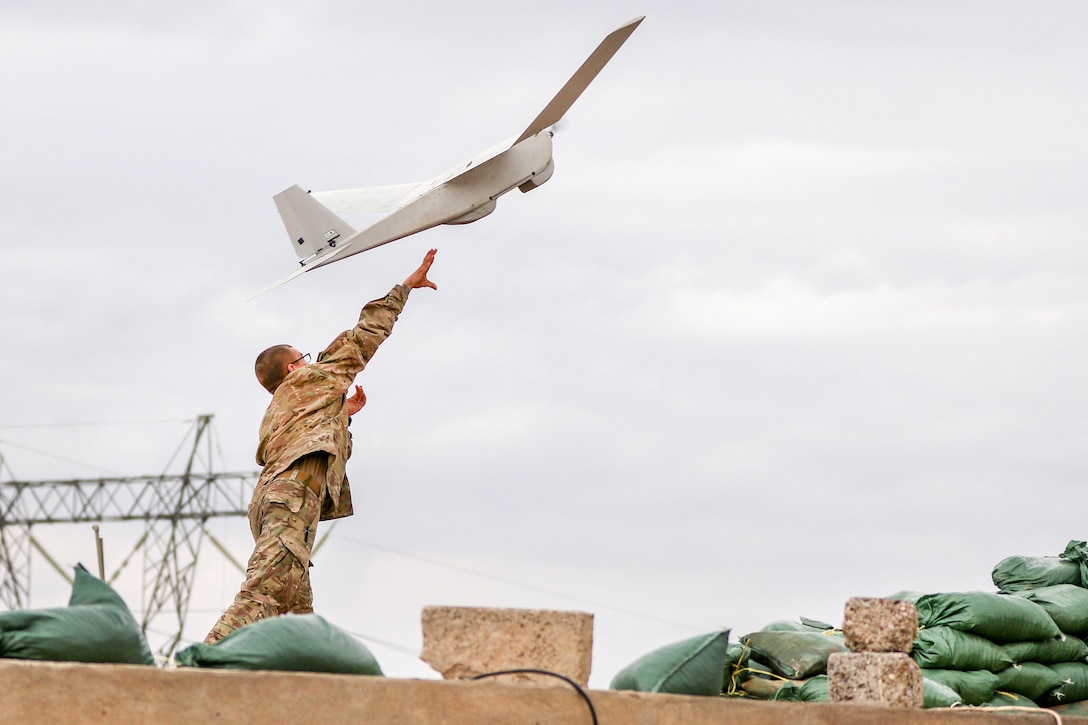 Army Spc. Taylor S. Tennant launches a Puma unmanned aerial vehicle near Al Tarab, Iraq, during an Iraqi security forces' offensive on an ISIS position near the western edge of Mosul, Iraq, March 19, 2017. Tennant is assigned to the 82nd Airborne Division’s 2nd Brigade Combat Team and serves under Combined Joint Task Force-Operation Inherent Resolve. Army photo by Staff Sgt. Jason Hull