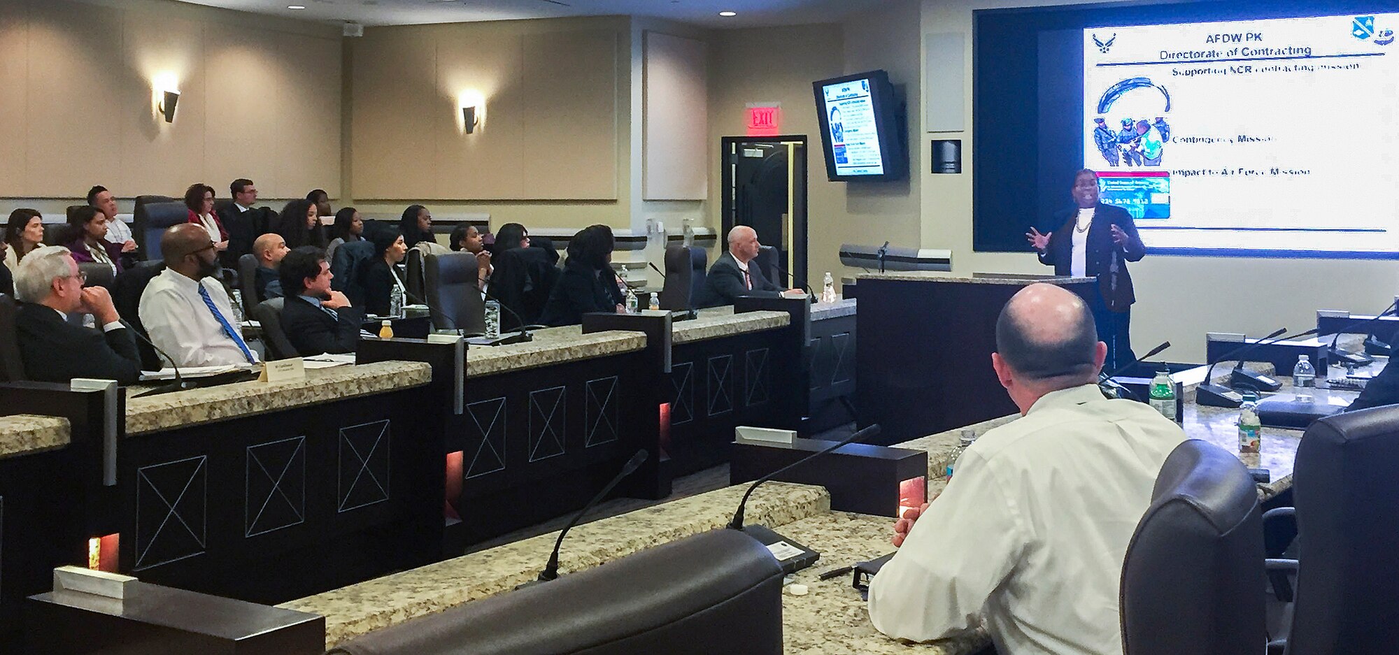 Ms. Yolanda Felder, Deputy Director of Contracting, Air Force District of Washington, briefs conference participants on the opportunities offered by AFDW to contracting professionals at the Smart Conference Center on Joint Base Andrews, Mar. 16, 2017. The conference was organized and hosted by Felder as a way to improve civilian retention through education on opportunities for career growth and broadening available in the Air Force. (U.S. Air Force photo/1st Lt. Katy Blessing)