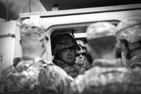 Army Reserve Staff Sgt. Jason Kelly, Combat Engineer, 366th Engineer Company, Canton New York, converses with Soldiers before conducting a gunnery crew live-fire qualification in a M113 Armored Personnel Carrier during the Operation Cold Steel exercise at Fort McCoy, Wisconsin, Mar. 23, 2017. Operation Cold Steel is the U.S. Army Reserve’s first large-scale live-fire training and crew-served weapons qualification and validation exercise taking place from March 9 through April 25, 2017. Cold Steel is key to ensuring that America’s Army Reserve units and Soldiers are trained and ready to deploy on short-notice and bring combat-ready and lethal firepower in support of the Total Army and Joint Force partners around the world. In support of the Total Army Force, First Army Master Gunners participated in Cold Steel to provide expertise in crew level gunnery qualifications, and to develop Vehicle Crew Evaluator training, preparing units here and when they return to their home stations to conduct crew served weapons training and vehicle crew gunnery at the unit-level. 475 crews with an estimated 1,600 Army Reserve Soldiers will certify in M2, M19 and M240 Bravo crew served weapons mounted to various military vehicle platforms such as Humvees, Family of Medium Tactical Vehicles, Heavy Expanded Mobility Tactical Trucks, and Heavy Equipment Transport Systems across 12-day rotations (15 crews per cycle) through the seven-week exercise.
(U.S. Army Reserve photo by Master Sgt. Anthony L. Taylor)