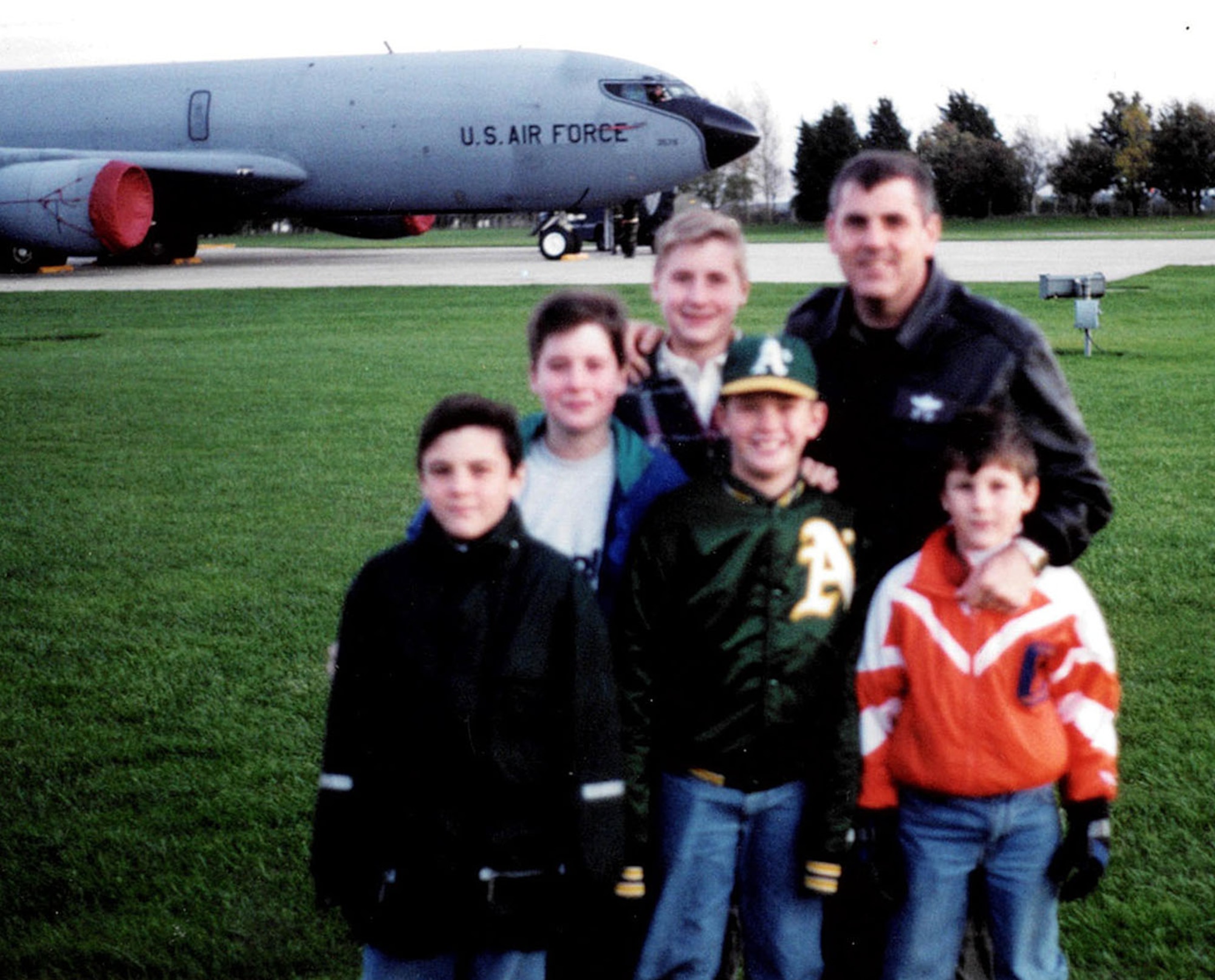 Then-U.S. Air Force Maj. Greg Teal, formerly 351st Air Refueling Squadron navigator, poses for a photo with his four sons and one of their friends May 1997 on RAF Mildenhall, England. His son Patrick, second left, is now a U.S. Air Force captain and pilot stationed at RAF Mildenhall, almost 25 years after their family first arrived in England. (Courtesy photo)