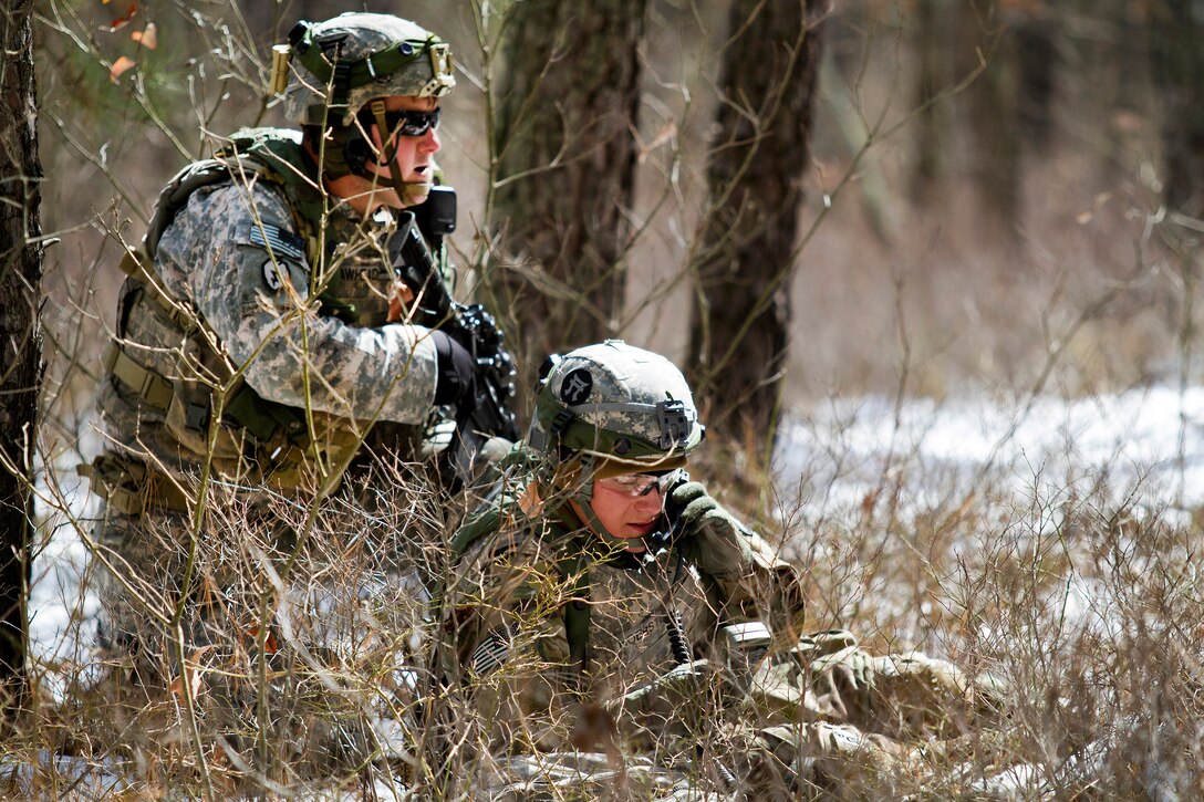 A soldier provides security for another soldier during Warrior Exercise 78-17-01 at Joint Base McGuire-Dix Lakehurst, N.J., March 16, 2017. Army Reserve Photo by Master Sgt. Mark Bell 