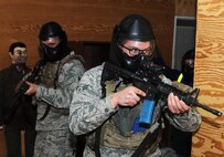 (Left to right) Senior Airman Dustin Fowler and Airman 1st Class Bryan Butler, 5th Security Forces Squadron defenders participate in close quarter battle training at Minot Air Force Base, N.D., March 16, 2017. The CQB training was part of the Global Strike Challenge tryouts for the 5th SFS. (U.S. Air Force photo/Senior Airman Kristoffer Kaubisch)