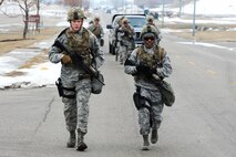 Defenders from the 5th Security Forces Squadron run during a buddy run at Minot Air Force Base, N.D., March 16, 2017. The buddy run was part of tryouts for the 2017 Global Strike Challenge. (U.S. Air Force photo/Senior Airman Kristoffer Kaubisch)