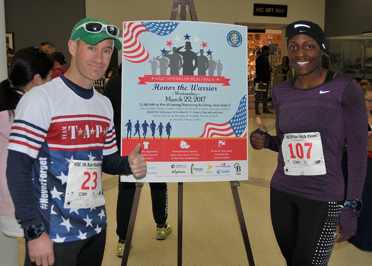 Navy Lt. Cdr. Ryan Stickel of DLA Logistics Operations and Army Chief Warrant Officer 4 Beofra Butler of DLA Human Resources, the no. 2 male and no. 1 female finishers, relax after the event.