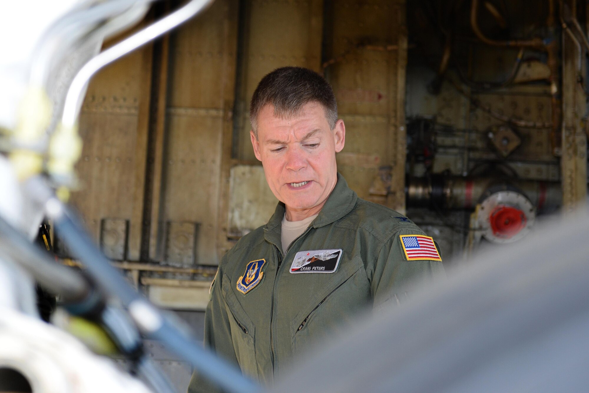 U.S. Air Force Col. Craig Peters, 940th Air Refueling Wing commander, preforms a pre-flight safety check on a U.S. Air Force KC-135 Stratotanker refueling aircraft, March 17, 2017, at Altus Air Force Base, Oklahoma. Peters participated in a refueling training mission where his KC-135 refueled a U.S. Air Force C-17 cargo aircraft which his son, U.S. Air Force Senior Airman Brendin Peters, 317th Airlift Squadron loadmaster, was training aboard. (U.S. Air Force photo by Airman 1st Class Cody Dowell/Released)

