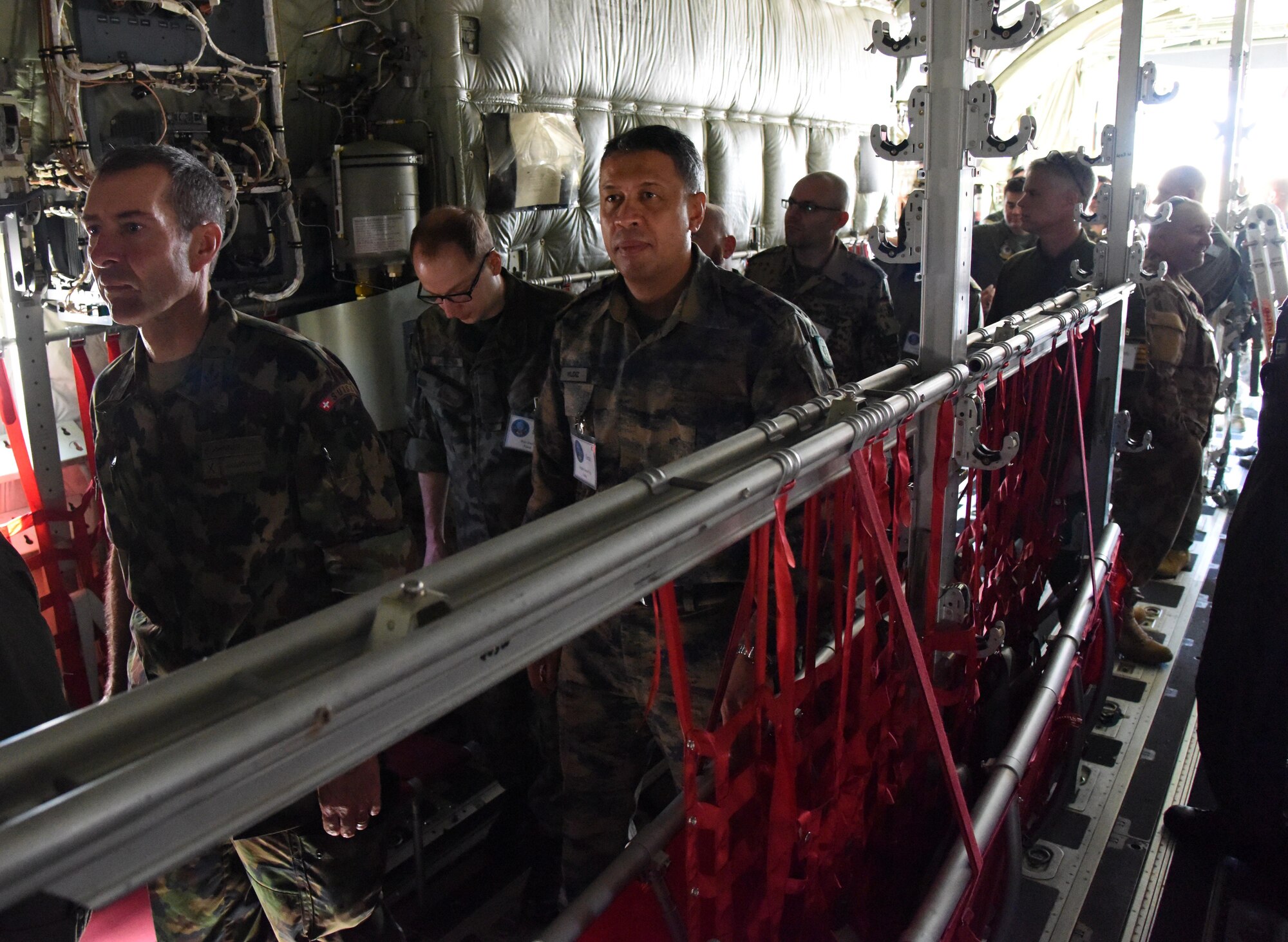 Air Attaché members receive a tour of a WC-130J Hercules during an Air Attaché visit March 20, 2017, on Keesler Air Force Base, Miss. The visit provided diplomatically accredited attachés with an overview of industrial, cultural and social aspects of the U.S. military and develop cordial relations amongst international attachés. (U.S. Air Force photo by Kemberly Groue)