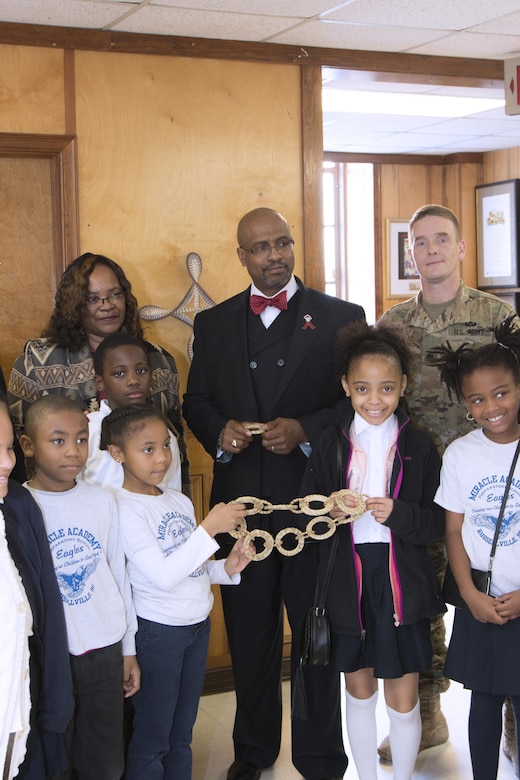 Students from Miracle Academy wove sweetgrass discs with sweetgrass from the Charleston District's Cooper River Rediversion Project, which were hung around a sweetgrass cross at Mother Emanuel AME Church.
