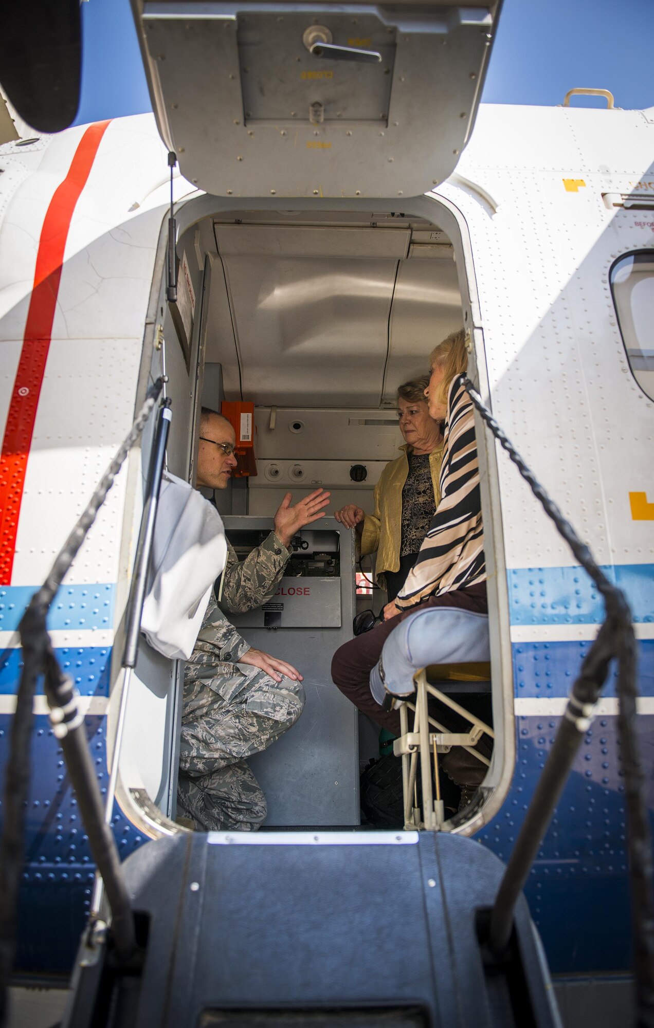 Maj. Terrell Eikner, the 919th Aircraft Maintenance Squadron commander, talks about the C-145A Skytruck’s capabilities with Crestview Military Affairs Committee members, Rita Smith and Marian McBryde during their tour of Duke Field, Fla., March 23.  (U.S. Air Force photo/Tech. Sgt. Samuel King Jr.)