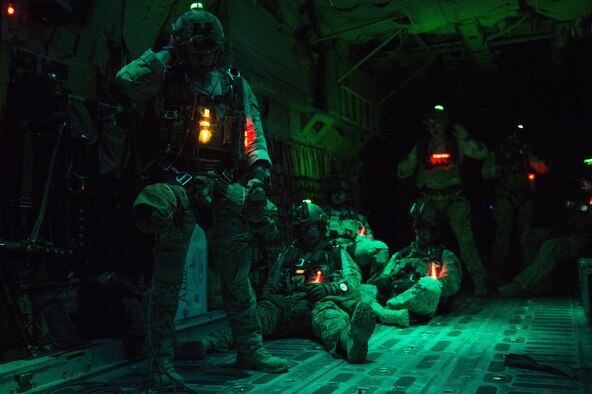 Pararescuemen from the 82nd Expeditionary Rescue Squadron prepare for a night jump from a C-130 Hercules over Grand Bara, Djibouti March 20, 2017. The training allowed the pararescuemen to maintain their qualifications on night jumps. The 82nd ERQS conducts full spectrum personnel recovery, casualty evacuation, medical evacuation, and sensitive item recovery in support of Defense Department  personnel. (U.S. Air Force photo/Tech. Sgt. Joshua J. Garcia)