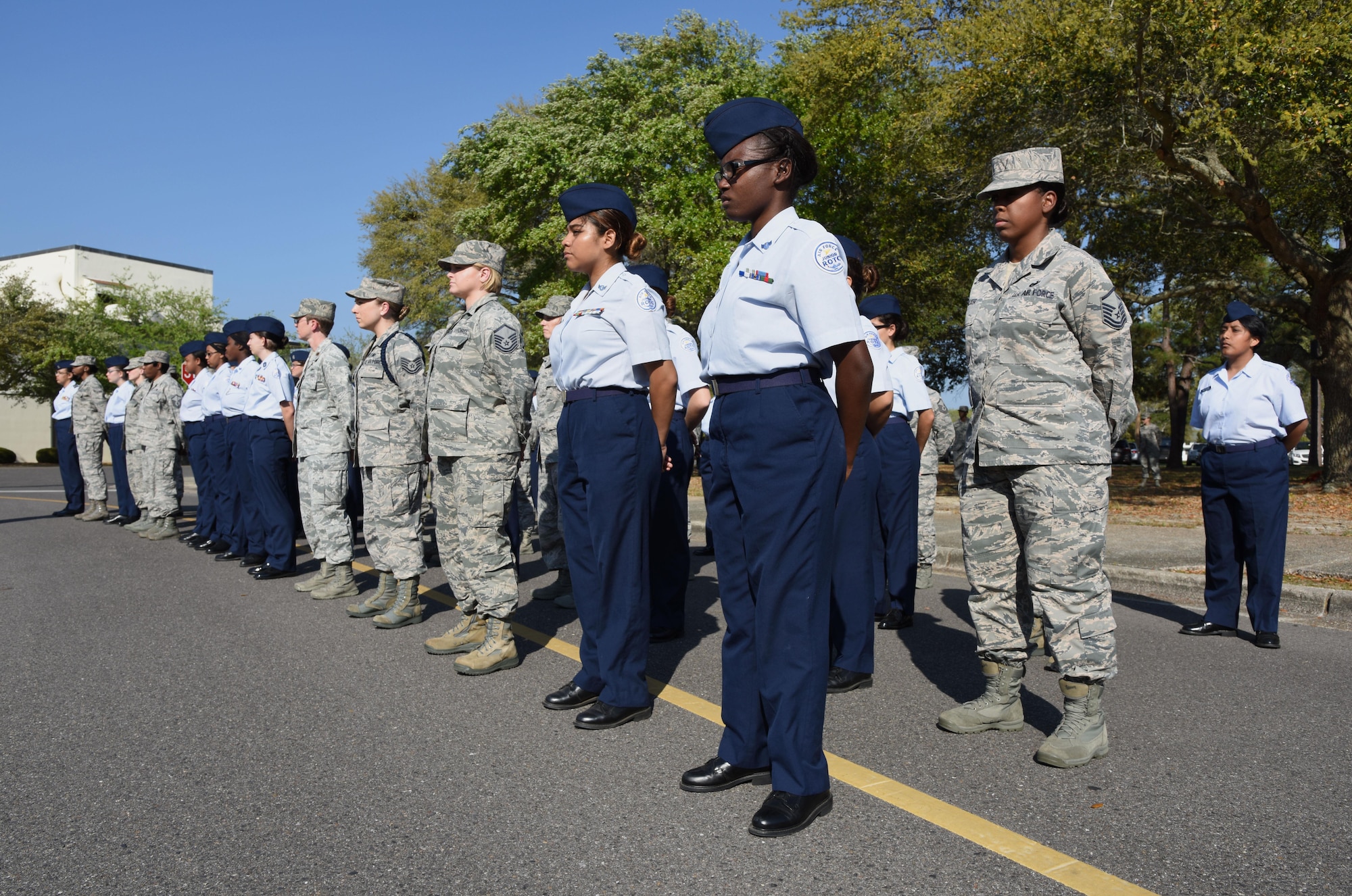 Airmen and Biloxi High School Junior ROTC cadets participate in a Women’s History Month all-female retreat ceremony March 21, 2017, on Keesler Air Force Base, Miss. The theme of 2017 WHM is “Honoring Trailblazing Women in Labor and Business” to honor women who have successfully challenged the female role in business and the paid labor force. (U.S. Air Force photo by Kemberly Groue)