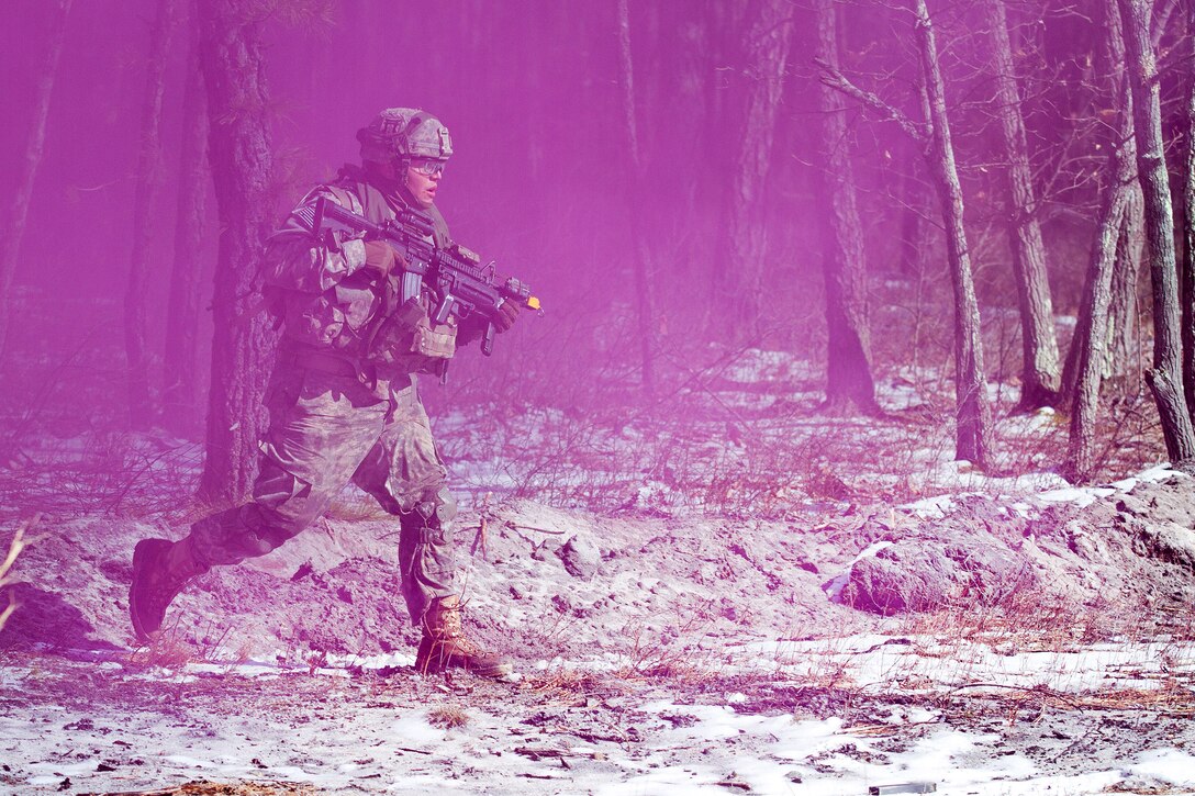 A soldier advances toward an enemy position under the cover of smoke during a hasty raid training exercise as part of Warrior Exercise 78-17-01 at Joint Base McGuire-Dix Lakehurst, N.J., March 16, 2017. Army Reserve Photo by Master Sgt. Mark Bell  