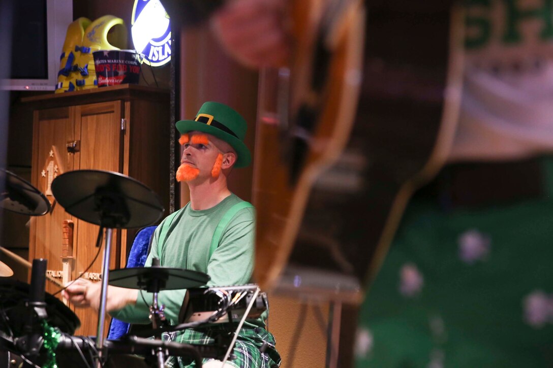 Capt. Christopher Mulkey, tactical communication division officer in charge, G-6 Communications and Information, plays the drums for his band, Shamus and Famous, during the Saint Patty’s Day Jamboree at the Frontline Restaurant aboard Marine Corps Air Ground Combat Center, Twentynine Palms, Calif., March 17, 2017. Shamus and Famous have played at the jamboree since 2016 and do so to create fun that everyone can enjoy. (U.S. Marine Corps photo by Cpl. Medina Ayala-Lo)