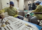 Senior Airman Vanessa Powell-Davis, right, 59th Dental Training Squadron periodontics technician, prepares a patient for periodontal surgery performed by Capt. Andrew Verrett, a 59th DTS periodontics resident, at the Air Force Postgraduate Dental School, Joint Base San Antonio-Lackland, Texas. The wing’s postgraduate medical education function provides a wide array of training programs ranging from general surgery to emergency medical services administration. (U.S. Air Force photo/Staff Sgt. Kevin Iinuma)