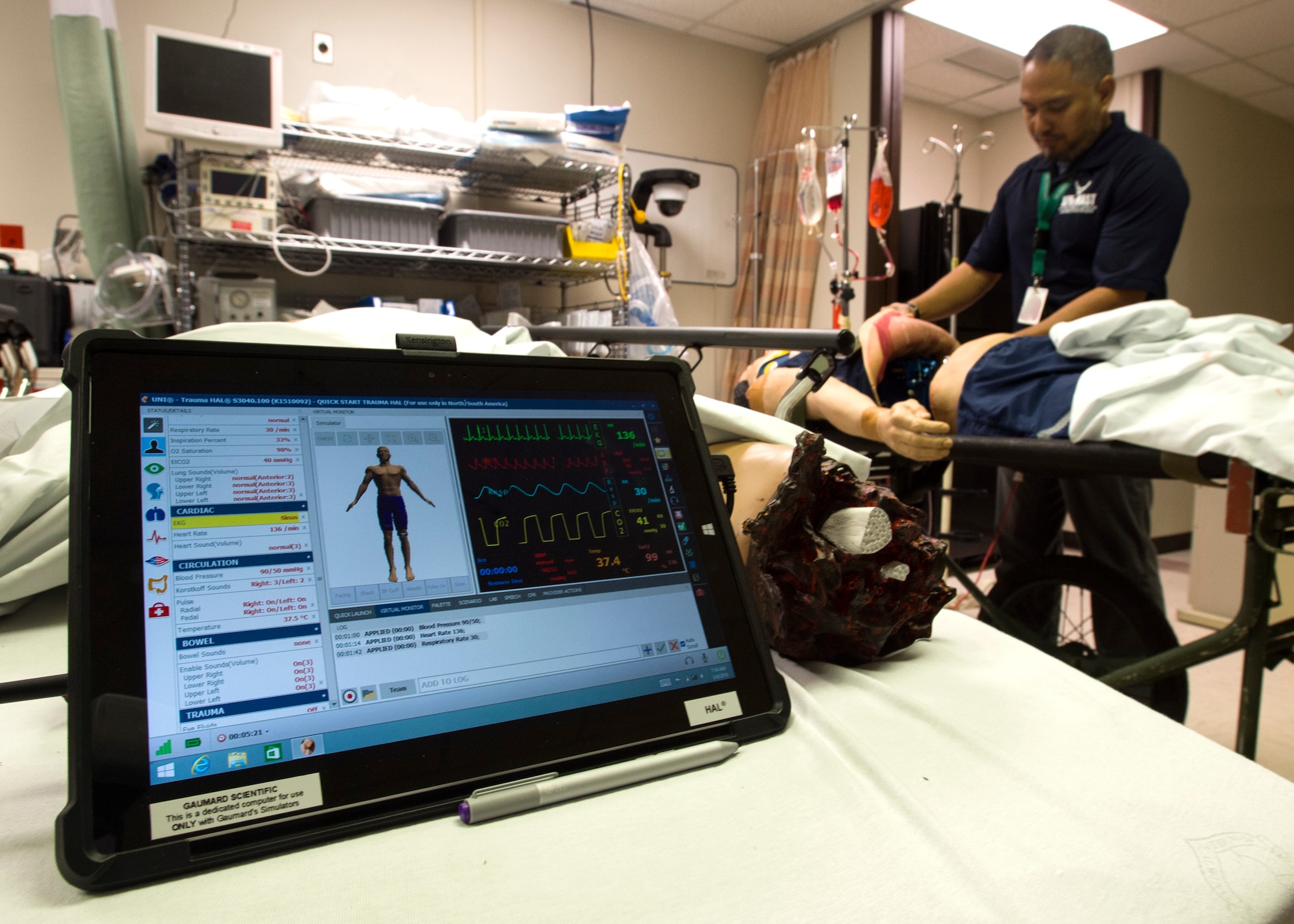 Mark Tuazon, 59th Medical Wing simulations operator, prepares mannequins for a simulation center open house at the Wilford Hall Ambulatory Surgical Center, Joint Base San Antonio-Lackland, Texas. Staff from the 59th MDW Simulation Center trains more than 5,000 Air Force, Army and Navy providers and technicians annually. Their goal is to provide the best training possible by diminishing the gap between the simulated training environment and real-world scenarios. (U.S. Air Force photo/Staff Sgt. Kevin Iinuma)