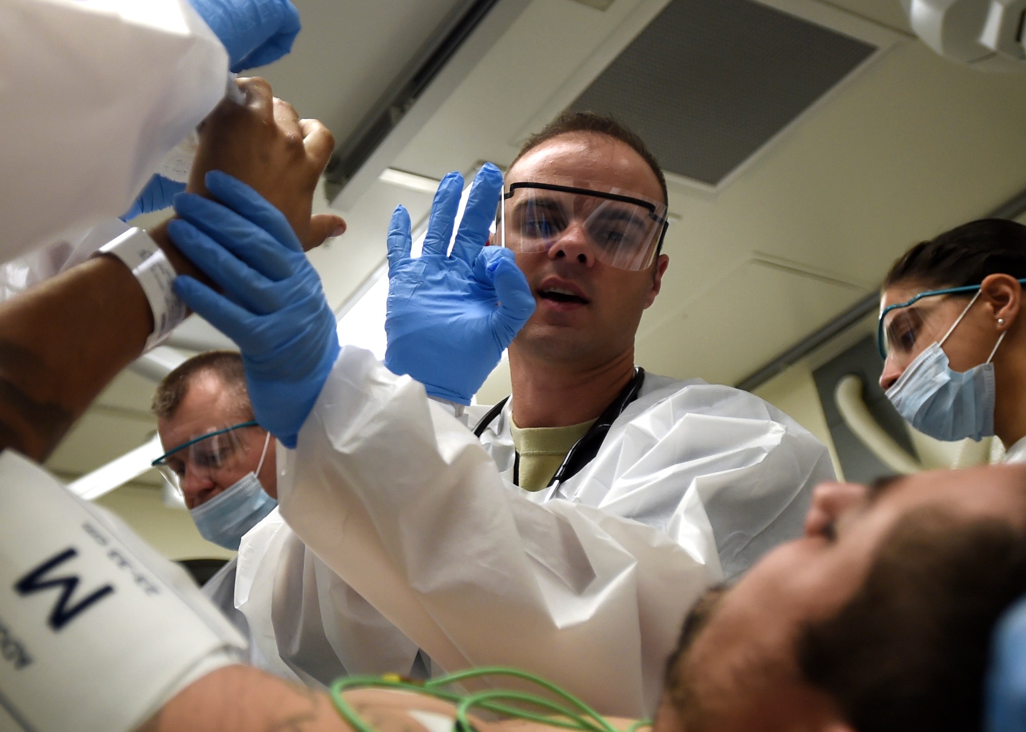 Air Force Capt. (Dr.) Kjell Ballard, emergency room resident, asks a patient to make the OK sign to check mobility of the fingers at the San Antonio Military Medical Center on Joint Base San Antonio-Fort Sam Houston, Texas. As the third largest medical group in the Air Force Medical Service, the 959th MDG is integrated with more than 6,000 Army and civilian personnel supporting operations at a 425-bed facility and the only Level 1 Trauma Center in the Department of Defense. (U.S. Air Force photo/Staff Sgt. Kevin Iinuma)