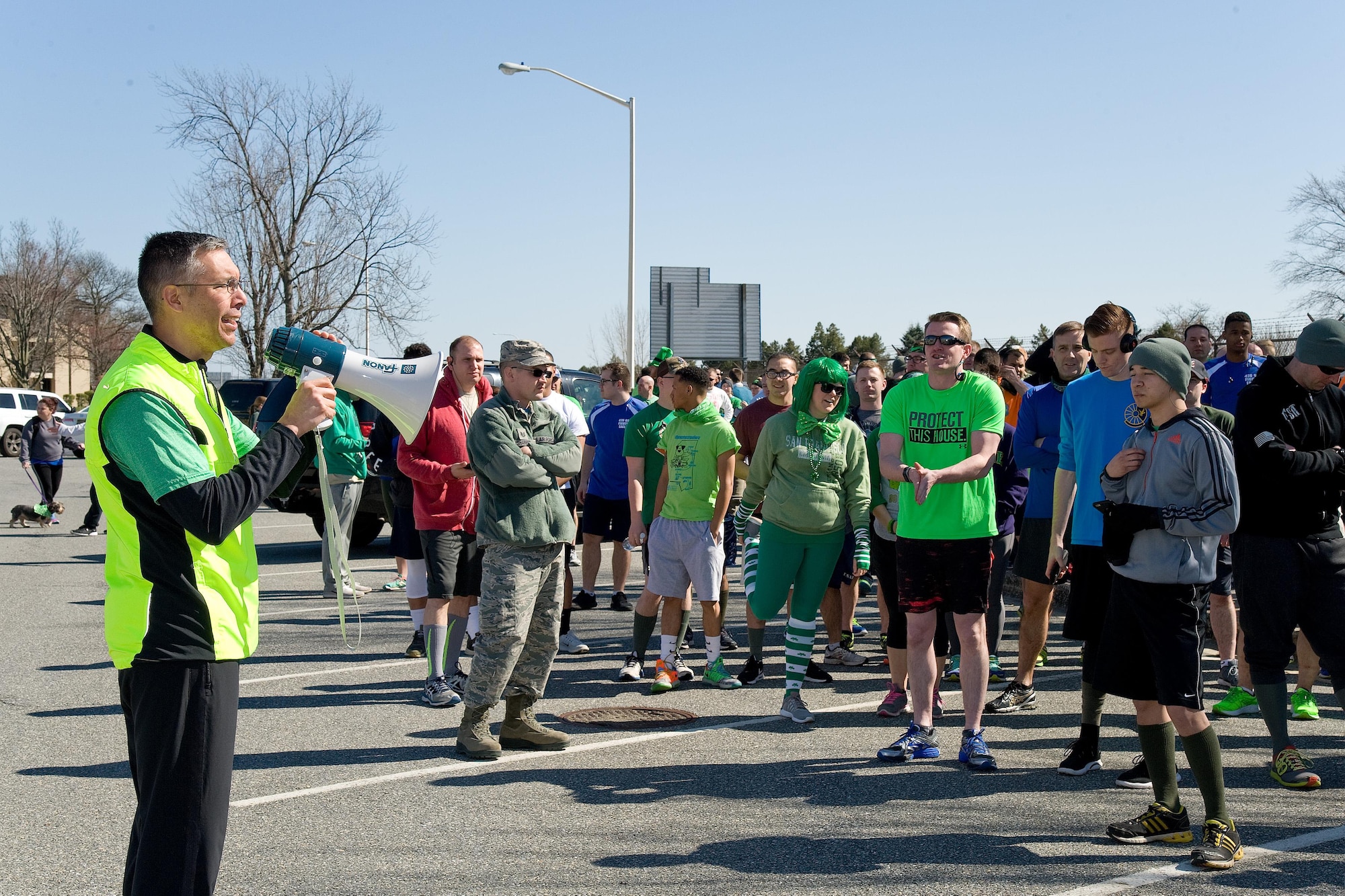 Col. Randy Boswell, 436th Mission Support Group commander, talks to runners prior to start of the "Four Leaf Clover Warrior Run," March 17, 2017, near The Landings on Dover Air Force Base, Del. The run was won by Tech. Sgt Ross Krotzer, 373rd Training Squadron, Detachment 3, in 19 minutes and 50 seconds.  Senior Airman Tamara Gensel, 436th Force Support Squadron, was the fastest female with a time of 23 minutes and 33 seconds. (U.S. Air Force photo by Roland Balik)
