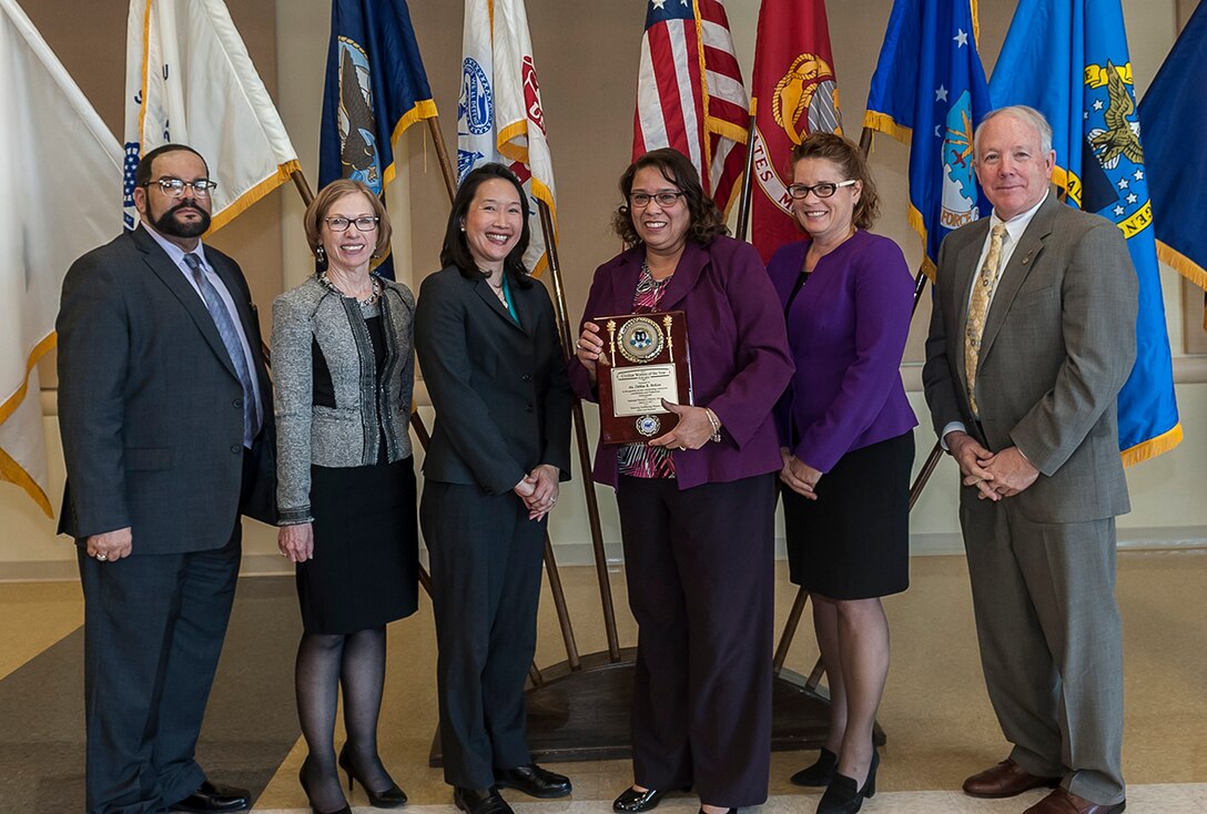 The 2017 Federal Civilian Woman of the Year was Debbie Perkins (center right). She received the award during an annual Women's History Month Luncheon Mar. 22 at Defense Supply Center Columbus. Pictured with Perkins is (from left) Charles Palmer, Land and Maritime EEO director; Deborah Haven, Land and Maritime deputy director of Maritime Customer Operations; Jenny Yang, U.S. EEO commissioner; Rebecca Beck, deputy site director for DFAS Columbus; and DLA Land and Maritime Deputy Commander, James McClaugherty.