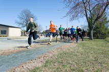 One hundred eighty-five Team Dover runners start the "Four Leaf Clover Warrior Run," March 17, 2017, on Dover Air Force Base, Del. The five kilometer race started and ended on the running trail near The Landings. The run was won by Tech. Sgt Ross Krotzer, 373rd Training Squadron, Detachment 3, in 19 minutes and 50 seconds.  Senior Airman Tamara Gensel, 436th Force Support Squadron, was the fastest female with a time of 23 minutes and 33 seconds. (U.S. Air Force photo by Roland Balik)