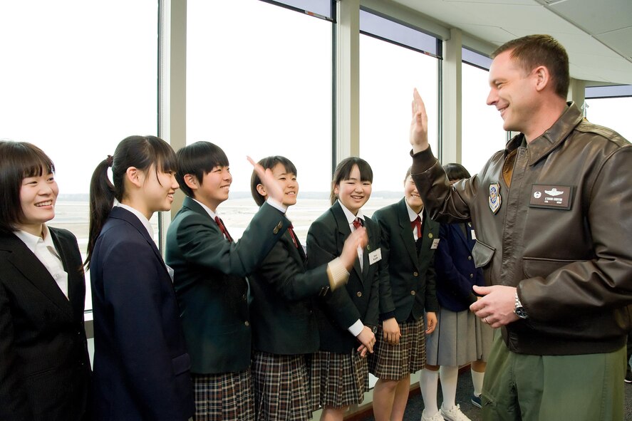 Col. Ethan Griffin, 436th Airlift Wing commander, greets junior high school students from the city of Iwanuma, Miyagi Prefecture, Japan, on the seventh floor of the Air Traffic Control Tower March 21, 2017, on Dover Air Force Base, Del. The students visited the city of Dover and facilities on Dover AFB during this year's tour. The city of Iwanuma is the sister city to Dover, Del. (U.S. Air Force photo by Roland Balik)