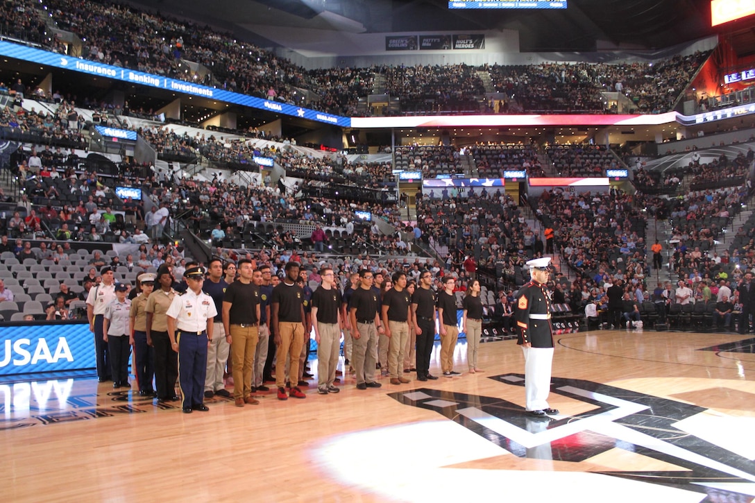 RS San Antonio Marine poolees participated in the San Antonio Spurs vs Memphis Grizzlies’ half-time show on March 23rd. The annual USAA and Spurs Military Appreciation Night honors military members, their families and Armed Forces enlistees. The future Marines raised their right hands in front of the packed AT&T Center audience to swear-in by repeating the Oath of Enlistment. (U.S. Marine Corps Photo by Sgt. Guadalupe Campos)